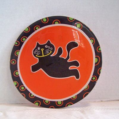 Black Cat on Orange Glass Plate