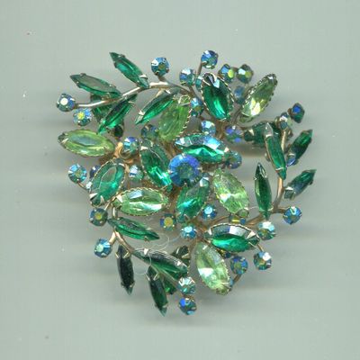 Large Swirling Designed Green Rhinestones Pin