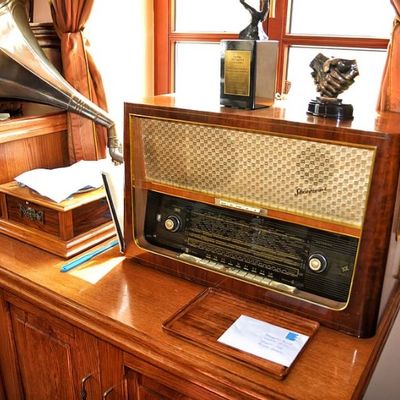 Vintage Mid-Century Modern Tube Radio with Gramophone Horn on Wooden Cabinet