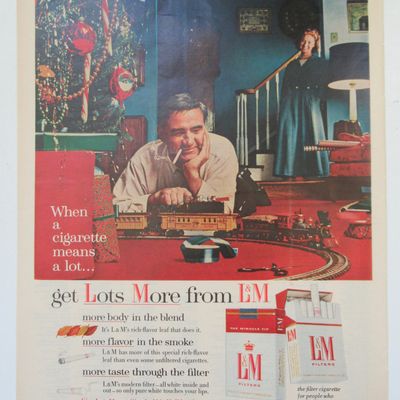 1955 L & M Cigarettes with Man Playing with Train