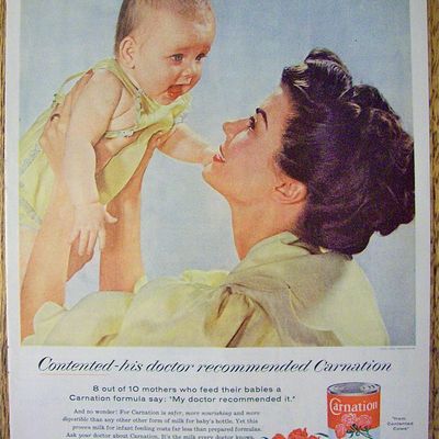 1955 Carnation Milk with Mother Holding Up Baby