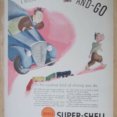 1937 Super Shell Gas with Boy Pulling Train