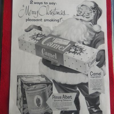 1951 Camel Cigarettes with Santa Claus Holding A Carton