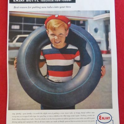 1958 Enjay Butyl with A Boy With An Inner Tube