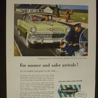 1956 Chevrolet with Couple Getting a Police Escort