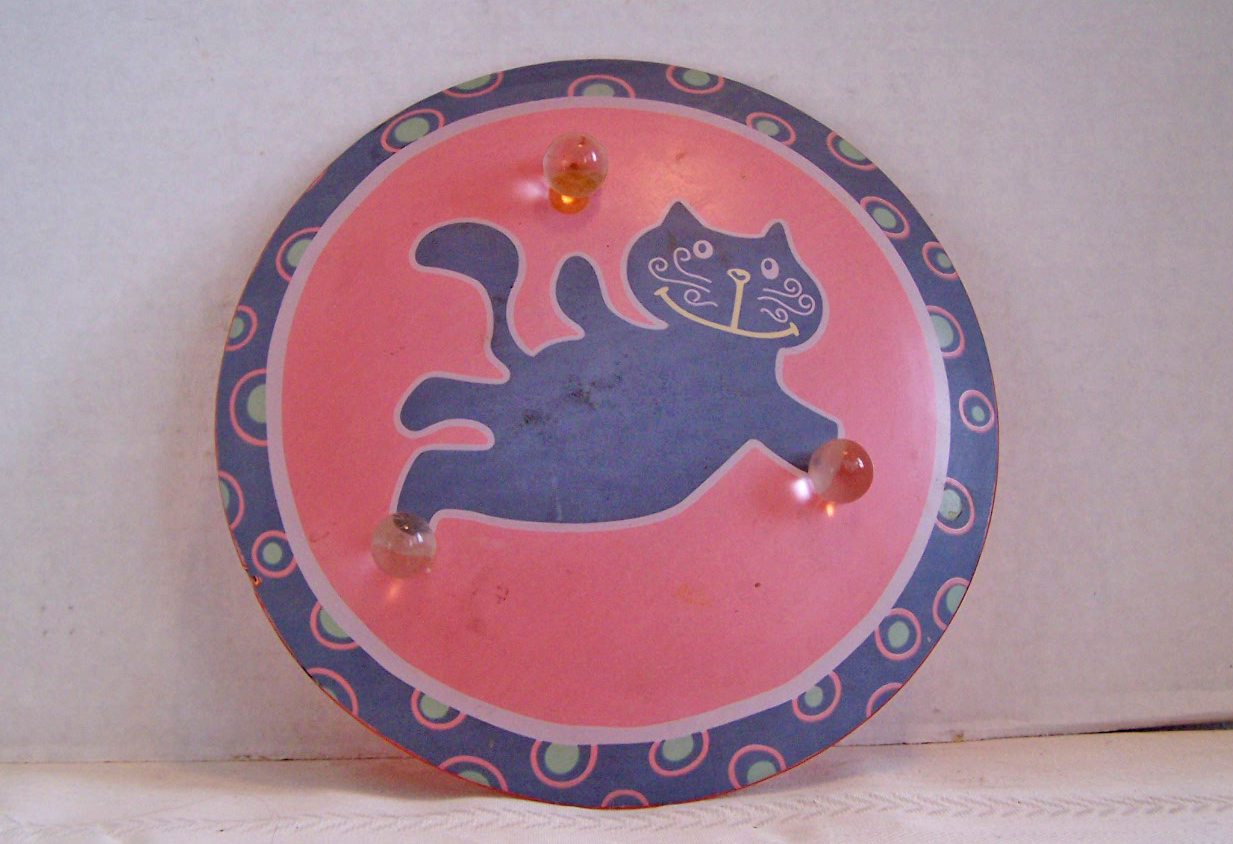 Black Cat on Orange Glass Plate