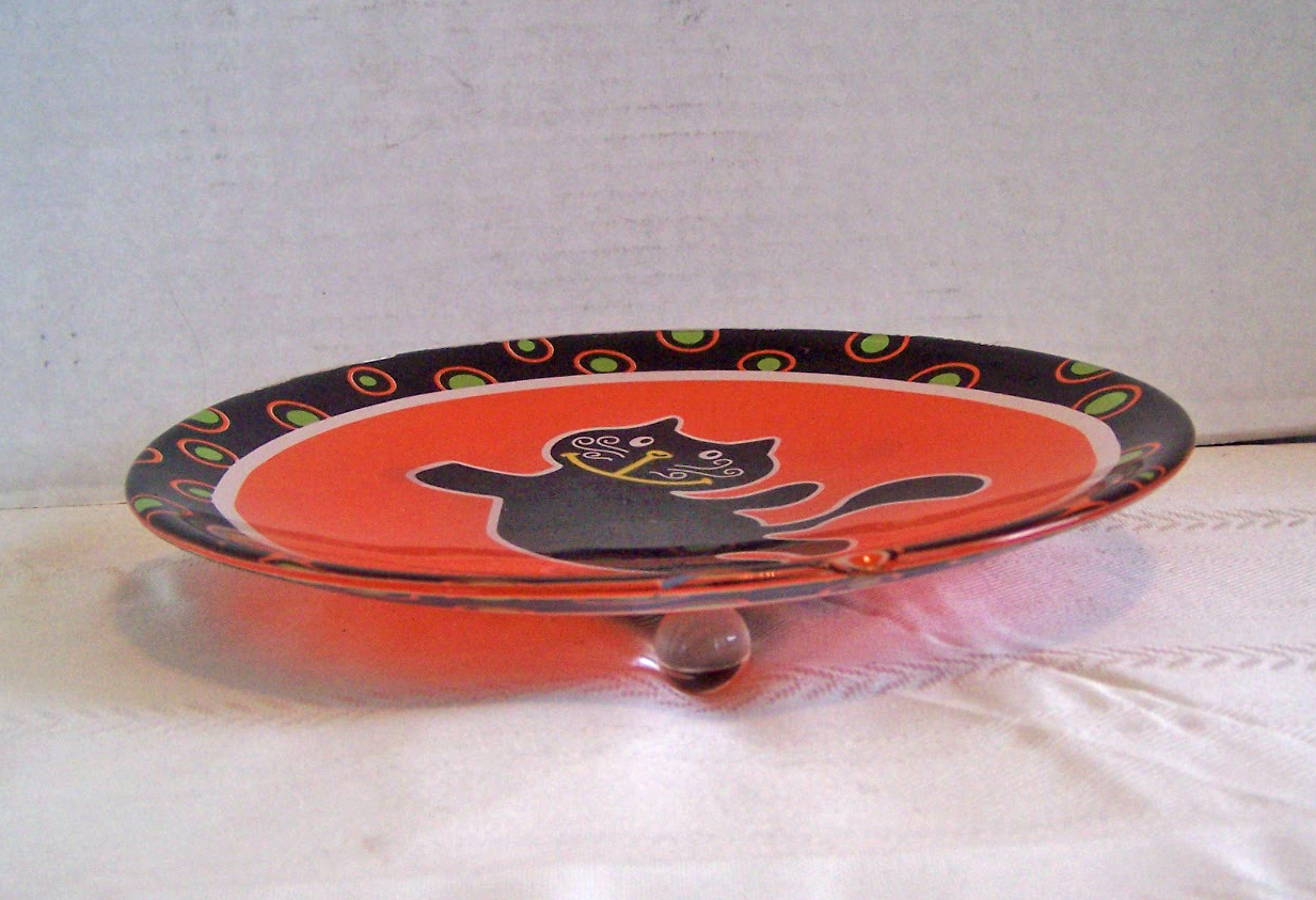 Black Cat on Orange Glass Plate