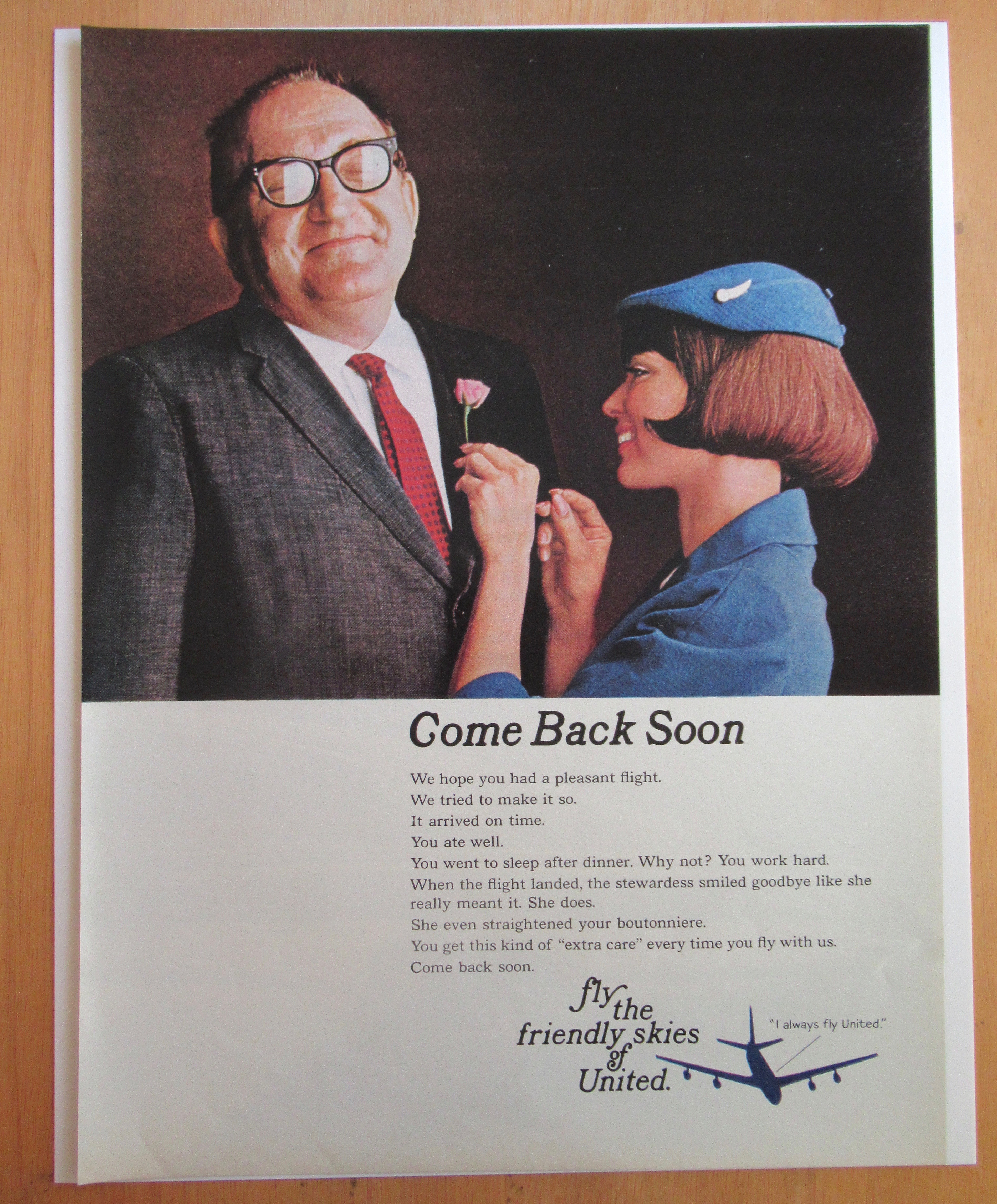 1966 United Airlines w/Stewardess Pinning Flower on Man