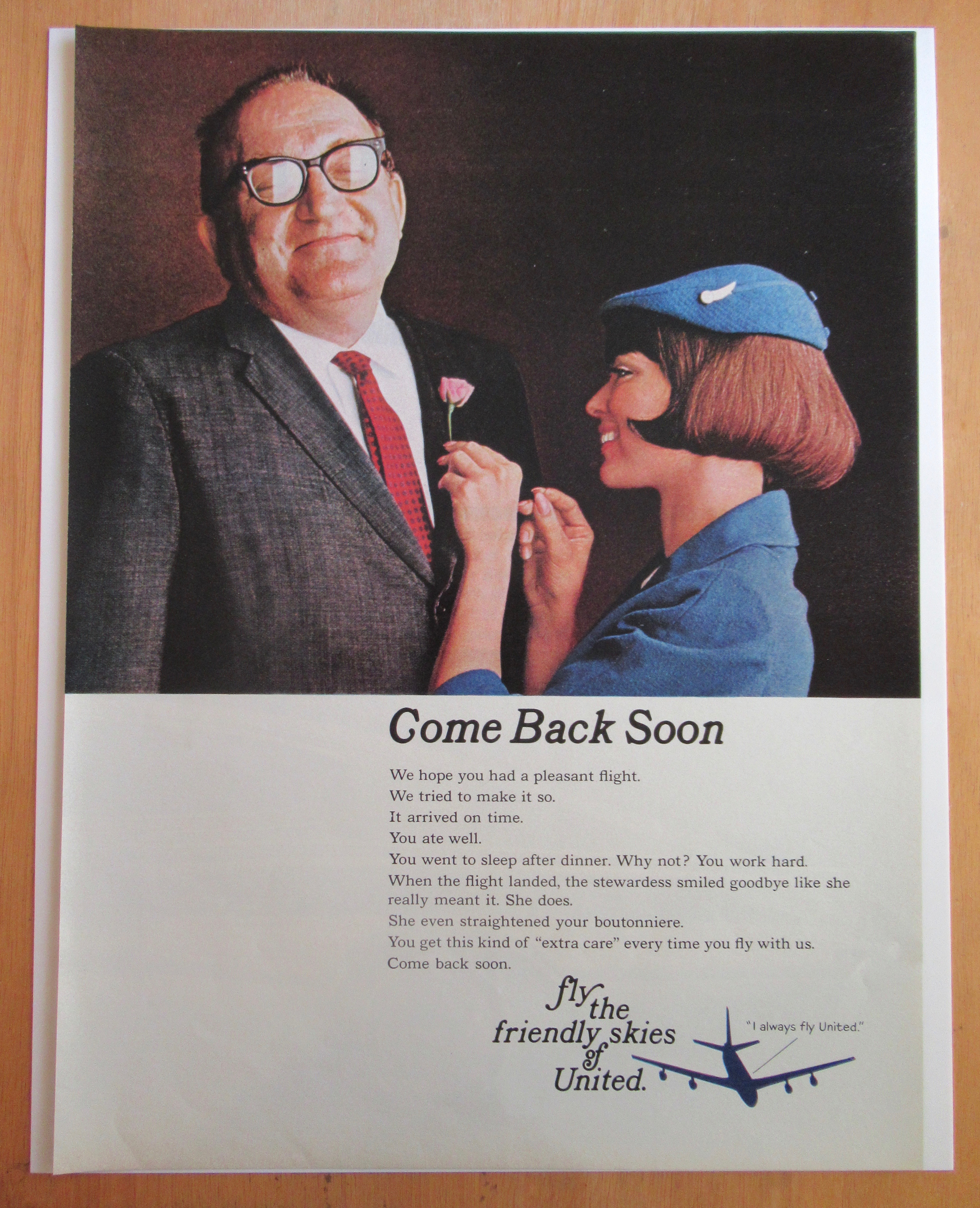 1966 United Airlines w/Stewardess Pinning Flower on Man