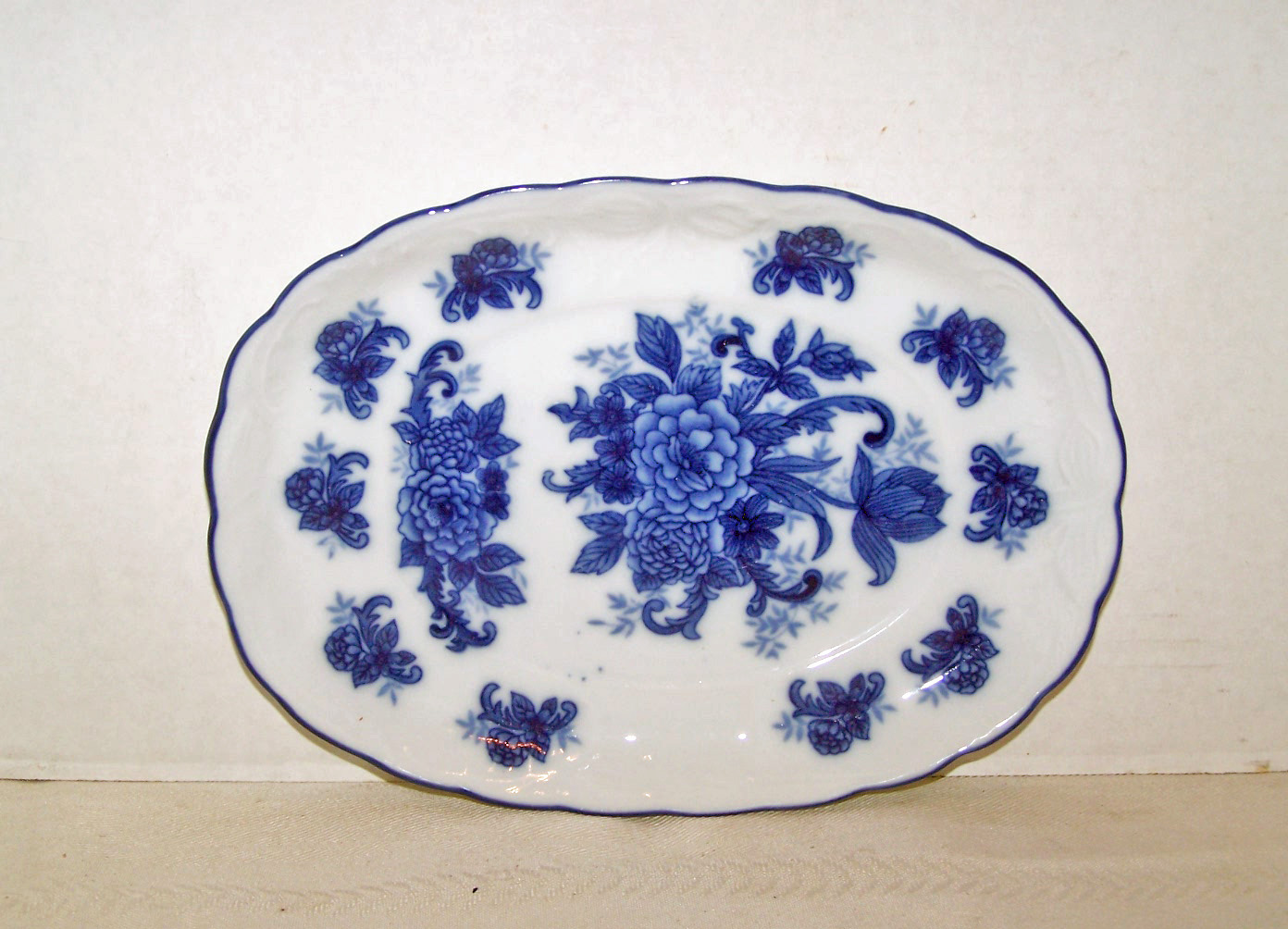 Blue Flowers on White Under Plate