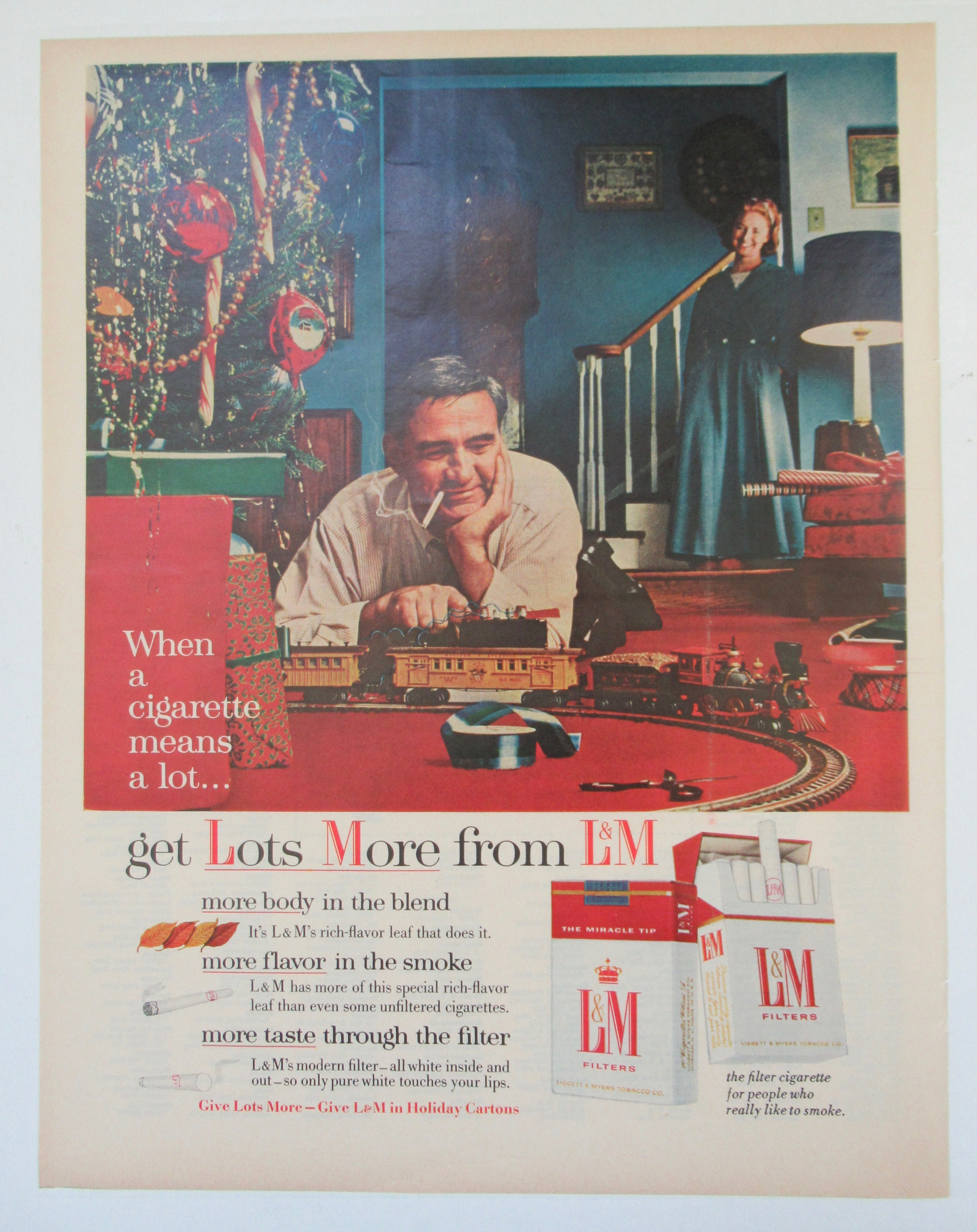 1955 L & M Cigarettes with Man Playing with Train