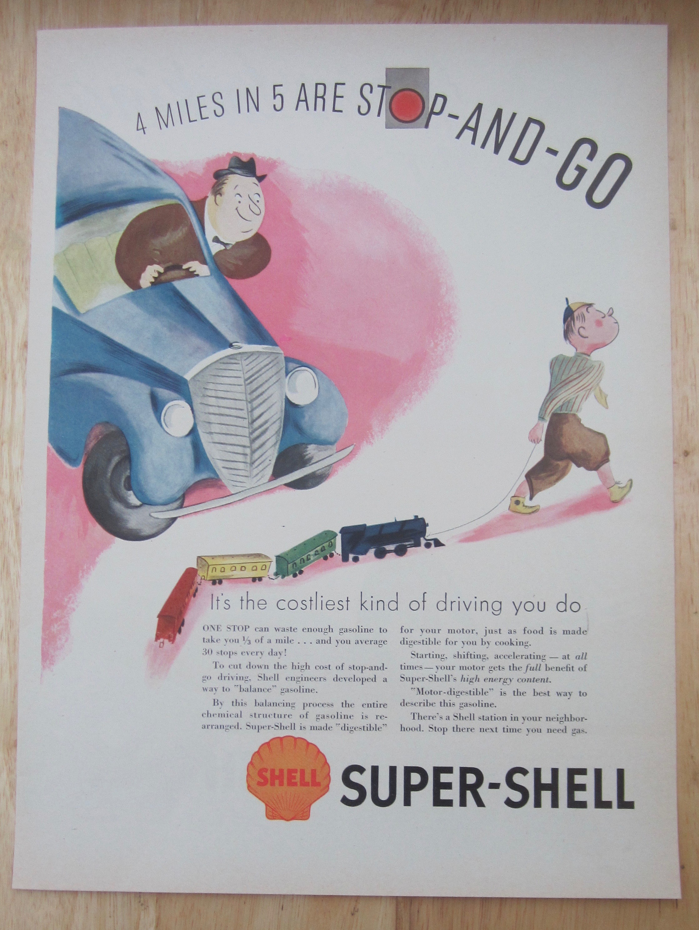 1937 Super Shell Gas with Boy Pulling Train