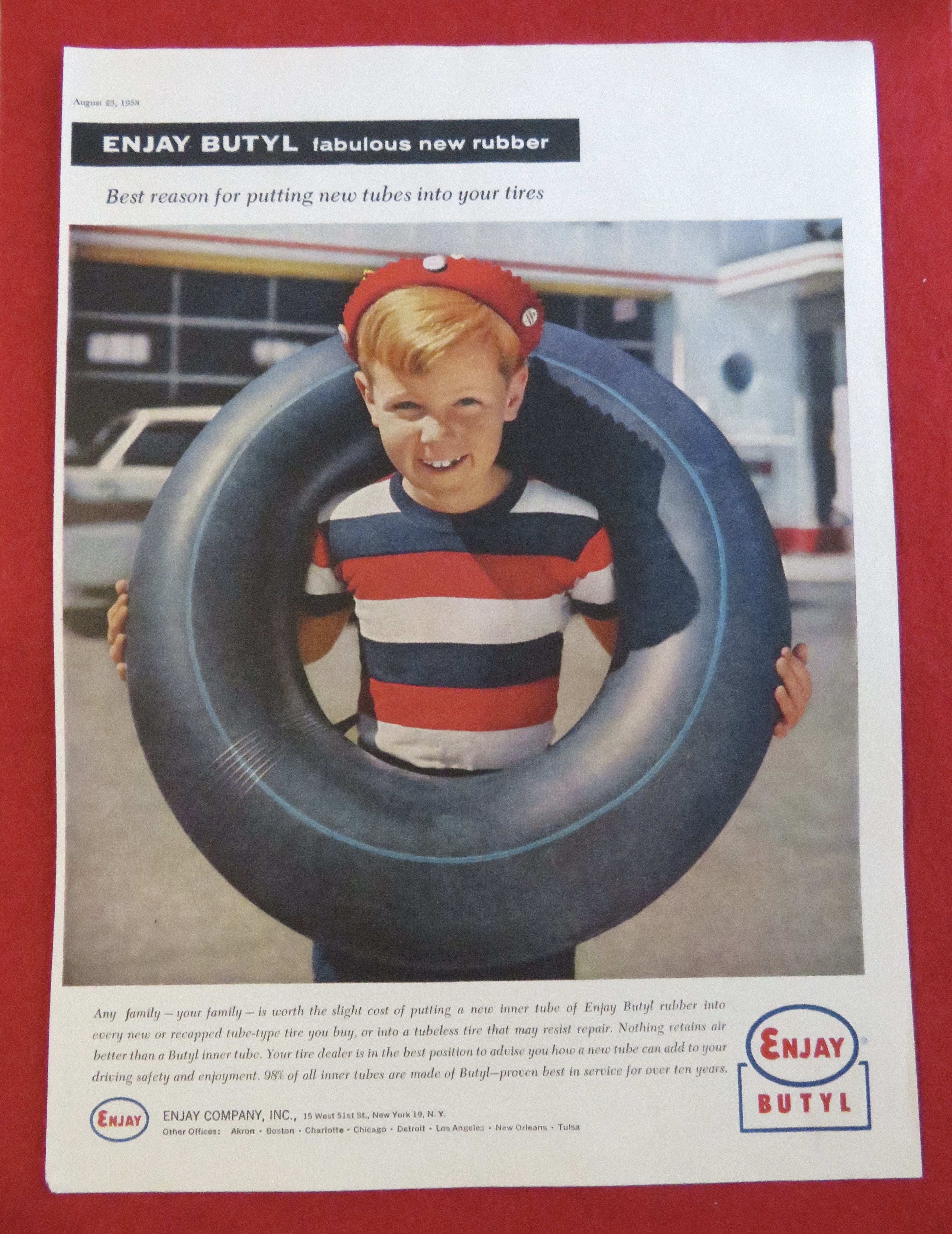 1958 Enjay Butyl with A Boy With An Inner Tube