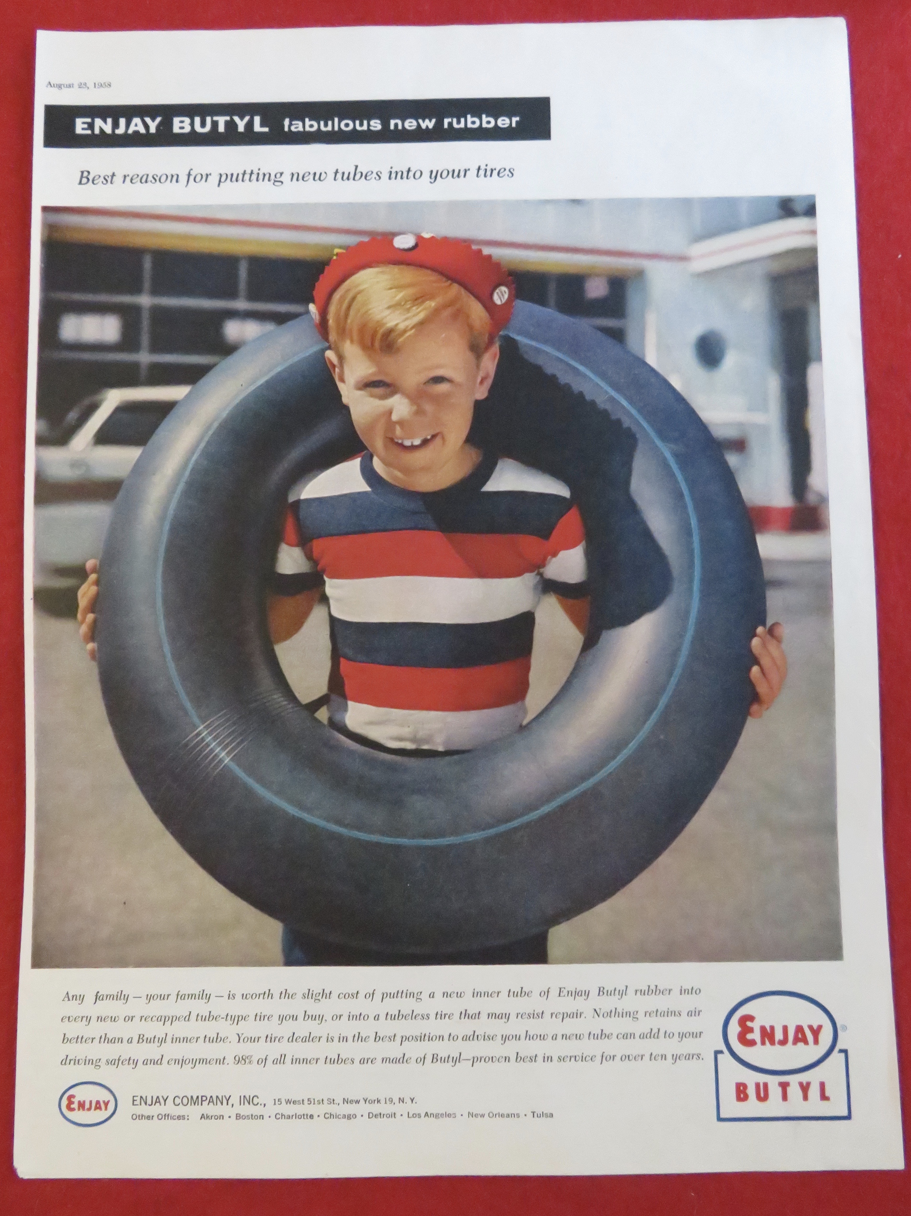 1958 Enjay Butyl with A Boy With An Inner Tube