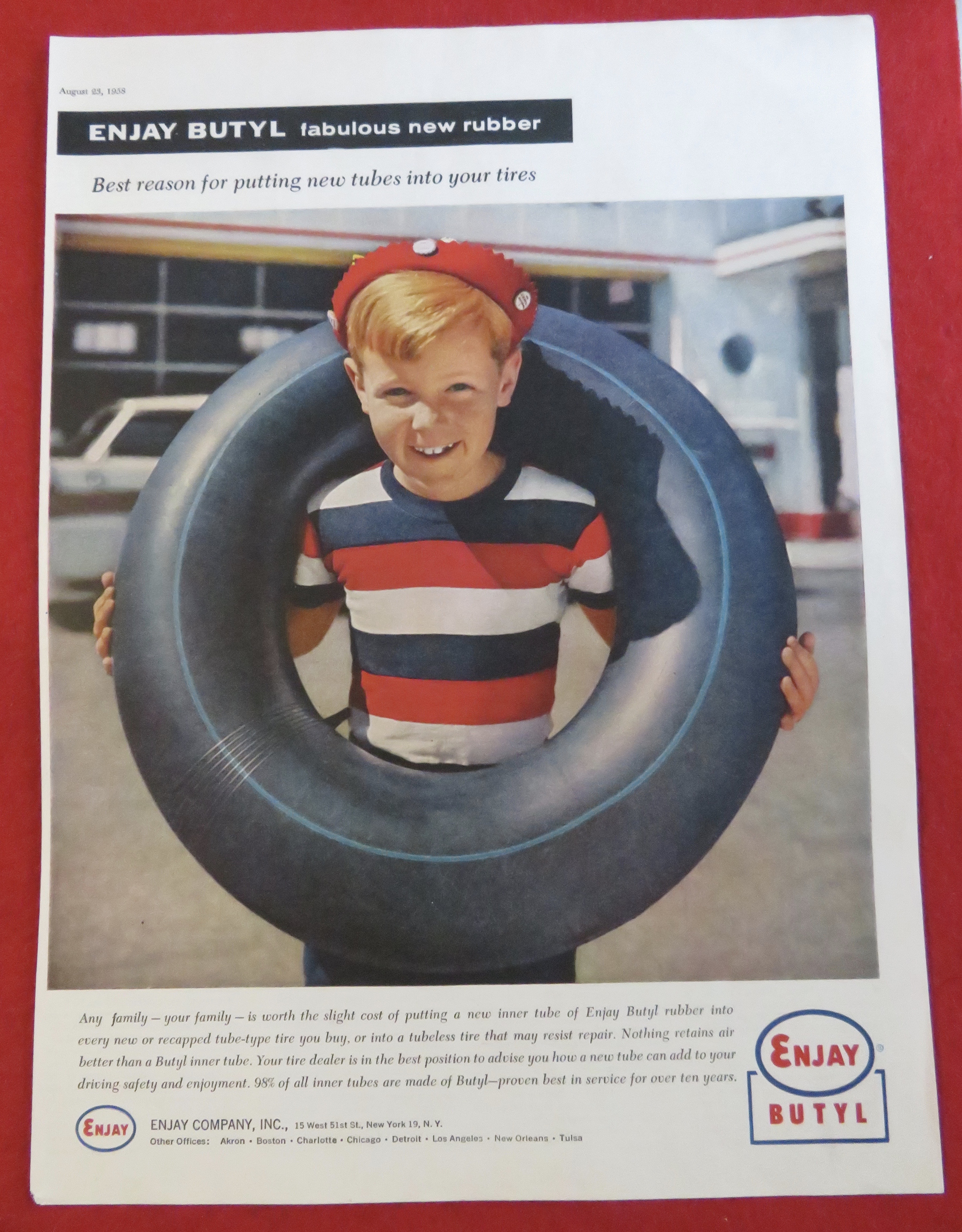 1958 Enjay Butyl with A Boy With An Inner Tube