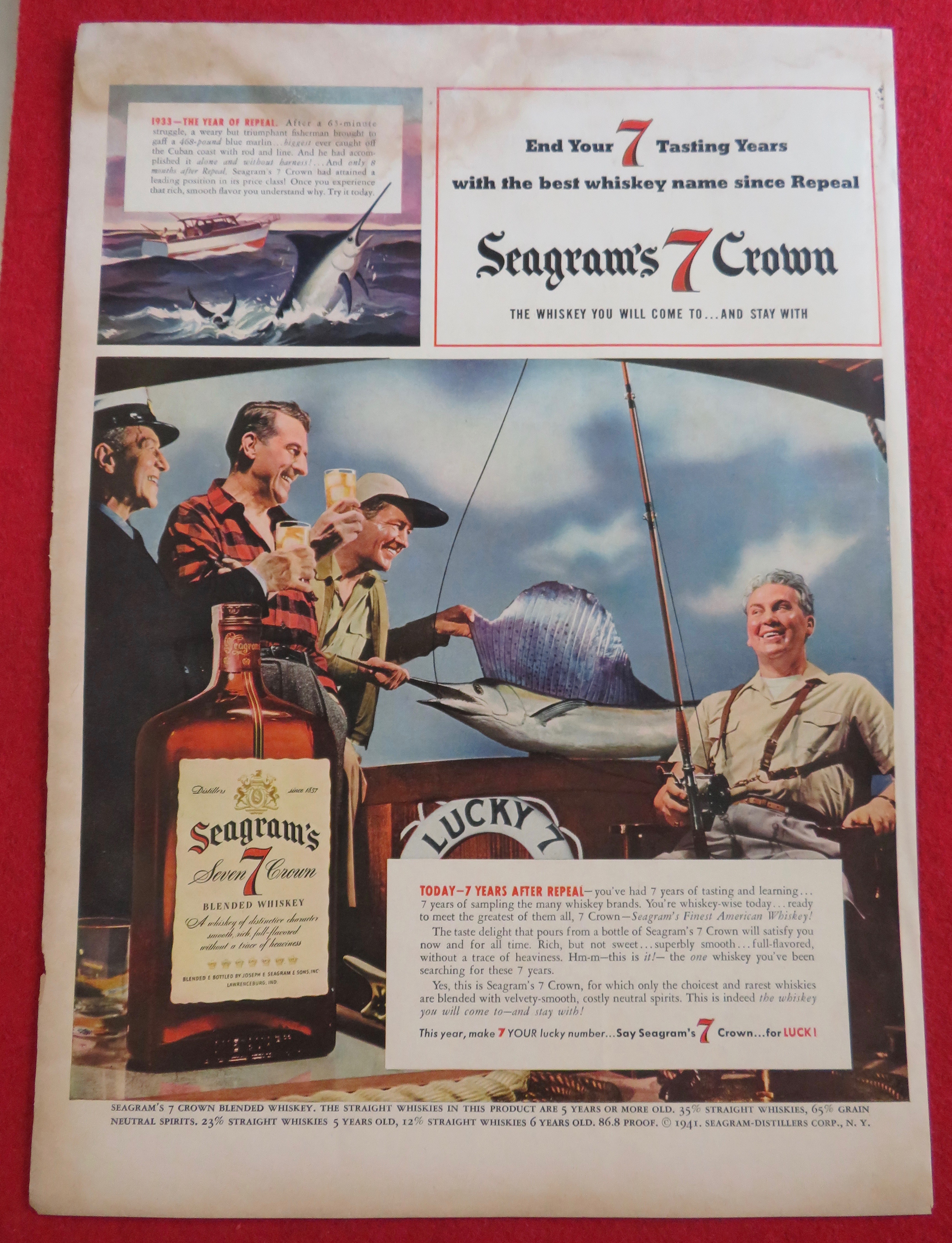 1941 Seagram's 7 Crown with Men Drinking With Big Fish