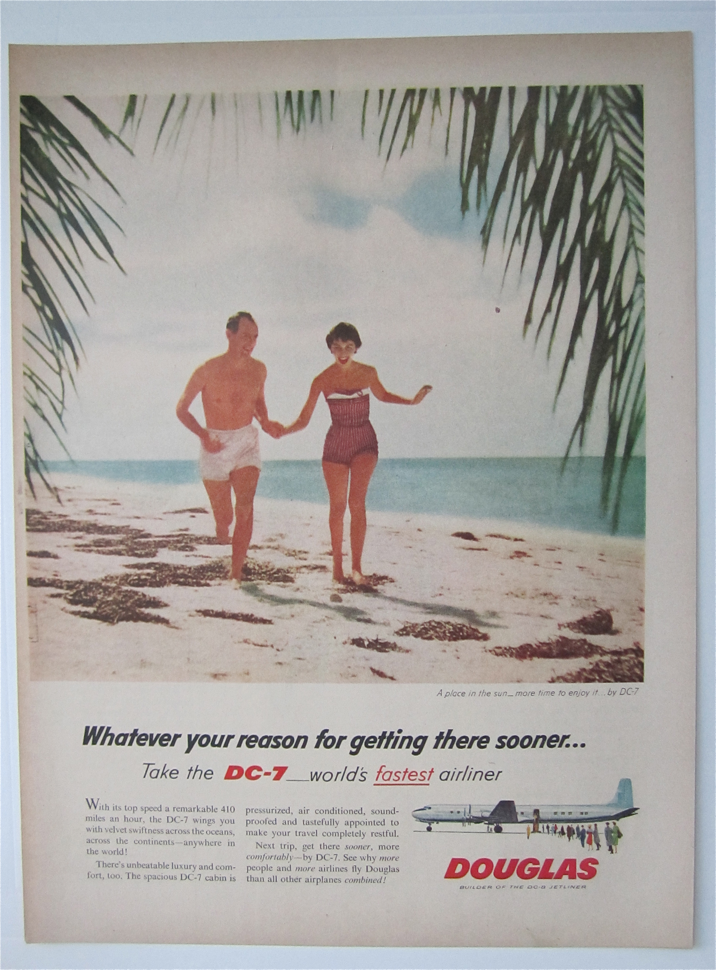 1957 Douglas DC-7 Airliner with Couple Running on Beach