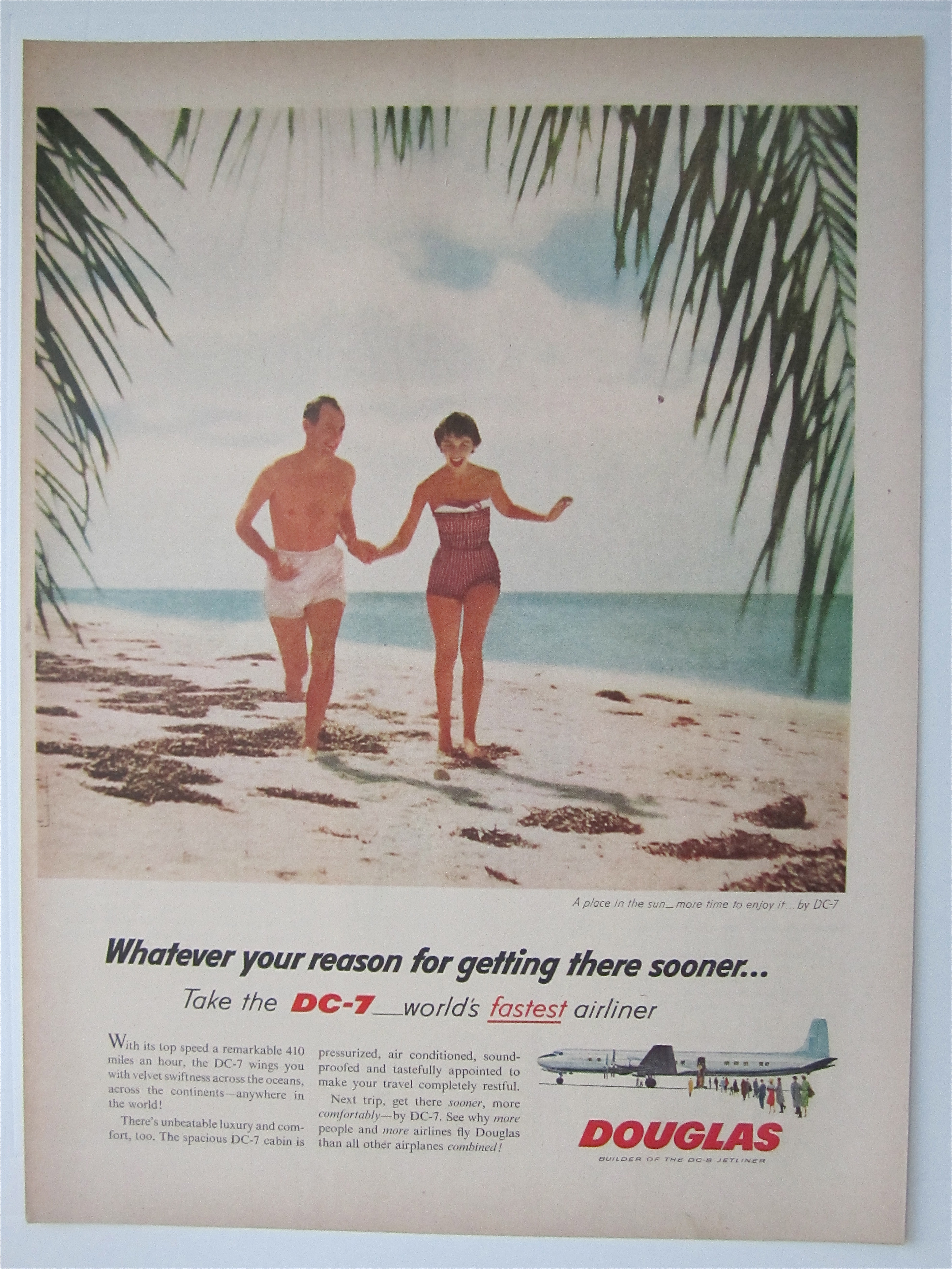 1957 Douglas DC-7 Airliner with Couple Running on Beach