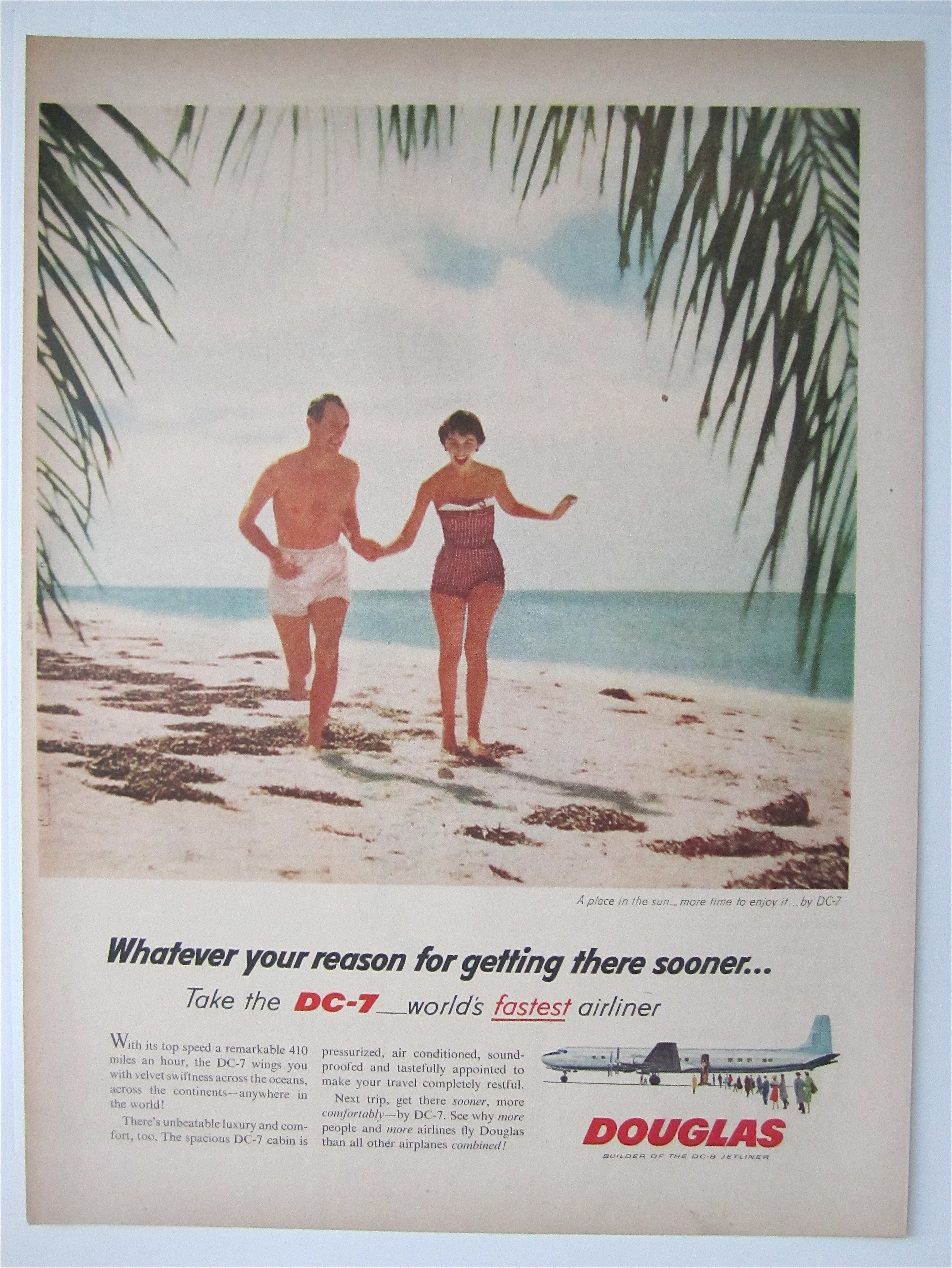 1957 Douglas DC-7 Airliner with Couple Running on Beach